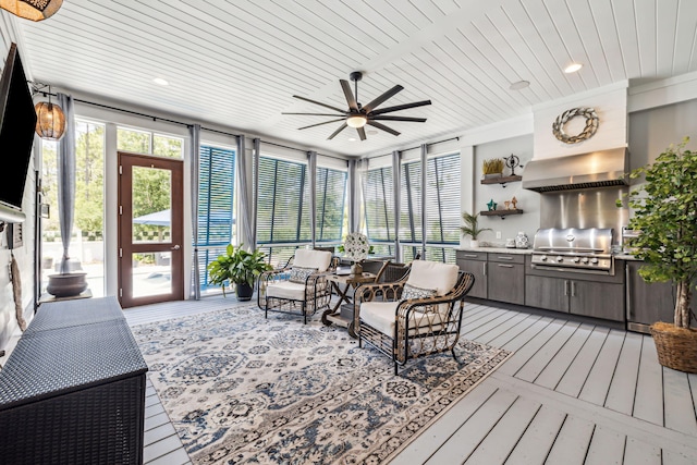 sunroom / solarium featuring wooden ceiling, floor to ceiling windows, hardwood / wood-style floors, and a deck