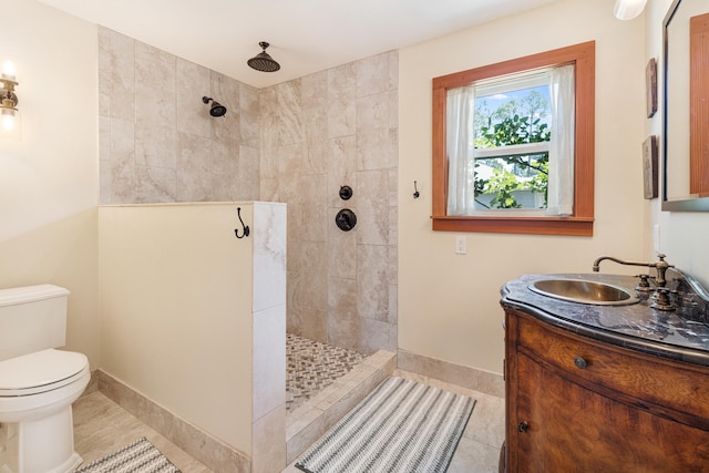 bathroom with a walk in shower, tile patterned floors, toilet, and baseboards