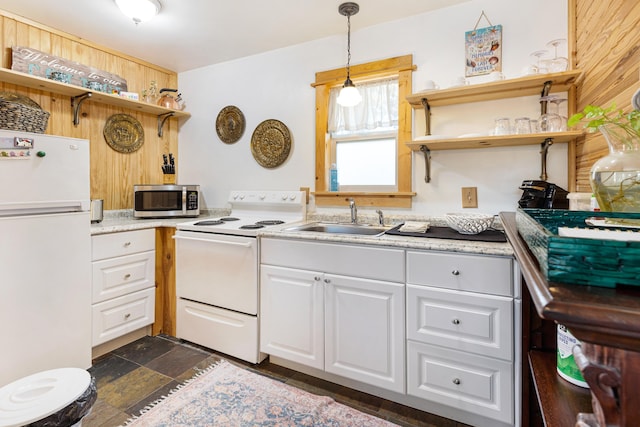 kitchen featuring open shelves, white appliances, a sink, white cabinetry, and light countertops