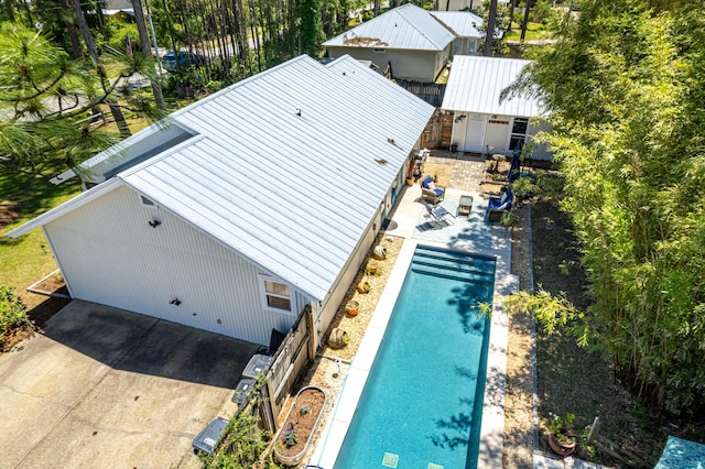 view of subject property featuring a pool area