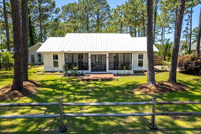 view of front of property featuring french doors and metal roof