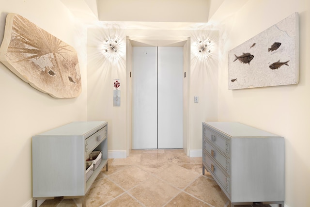 15400 Emerald Coast Pkwy Unit 301, Destin, FL 32541 - hall featuring elevator and baseboards