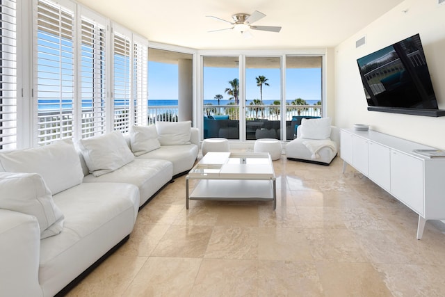 15400 Emerald Coast Pkwy Unit 301, Destin, FL 32541 - living area featuring a ceiling fan and a wall of windows