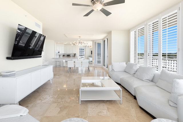 15400 Emerald Coast Pkwy Unit 301, Destin, FL 32541 - living room featuring a chandelier and ceiling fan