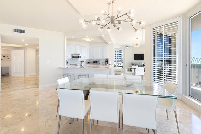 15400 Emerald Coast Pkwy Unit 301, Destin, FL 32541 - dining area featuring baseboards, a chandelier, a ceiling fan, and recessed lighting