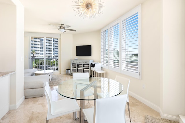 15400 Emerald Coast Pkwy Unit 301, Destin, FL 32541 - dining area with a ceiling fan and baseboards