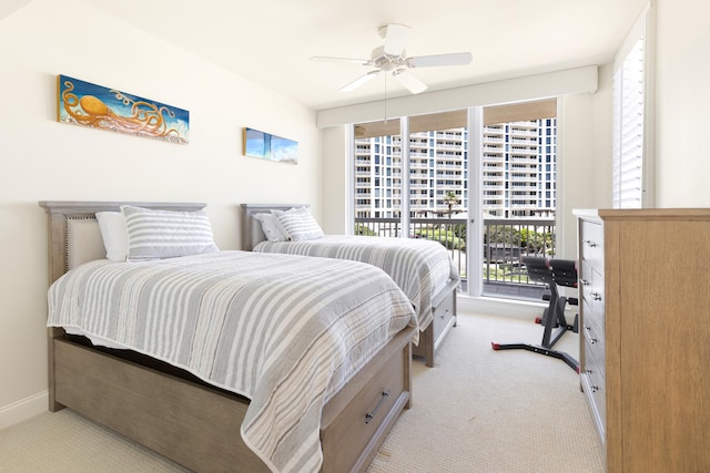 15400 Emerald Coast Pkwy Unit 301, Destin, FL 32541 - bedroom featuring light colored carpet, multiple windows, baseboards, and a ceiling fan
