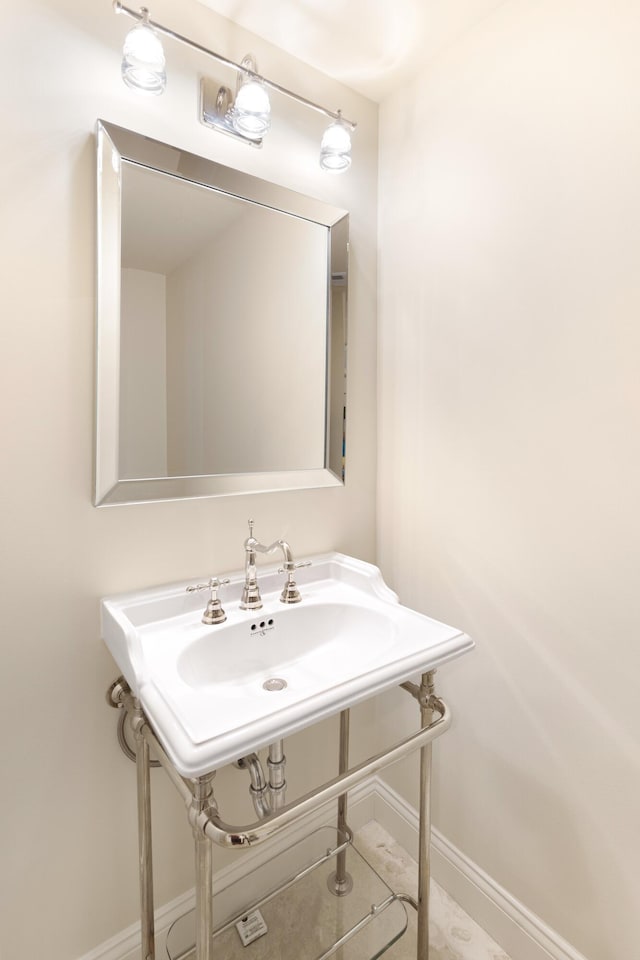 15400 Emerald Coast Pkwy Unit 301, Destin, FL 32541 - bathroom with baseboards and a sink