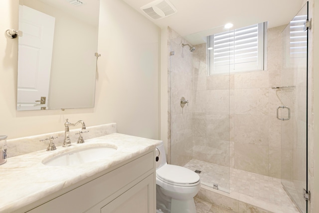 15400 Emerald Coast Pkwy Unit 301, Destin, FL 32541 - bathroom featuring a shower stall, toilet, and vanity