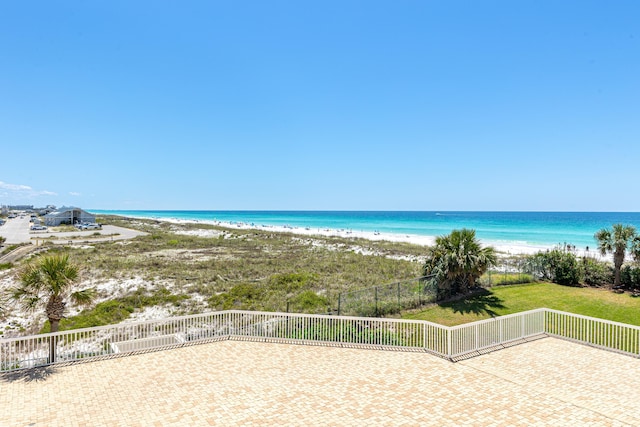 15400 Emerald Coast Pkwy Unit 301, Destin, FL 32541 - water view featuring nearby beach and fence