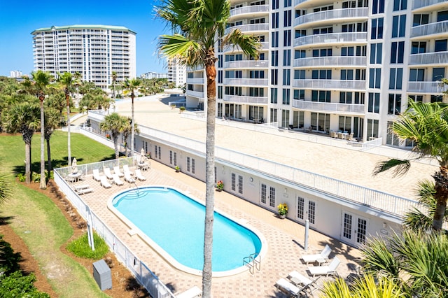 15400 Emerald Coast Pkwy Unit 301, Destin, FL 32541 - community pool with french doors, a patio area, and fence