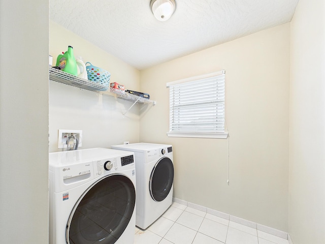 5261 Moore Loop, Crestview, FL 32536 - laundry room with washing machine and dryer and light tile patterned floors