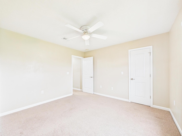 5261 Moore Loop, Crestview, FL 32536 - unfurnished bedroom with light colored carpet and a ceiling fan