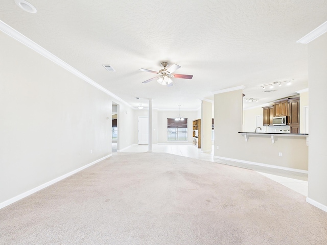 5261 Moore Loop, Crestview, FL 32536 - unfurnished living room with crown molding, a ceiling fan, and light carpet