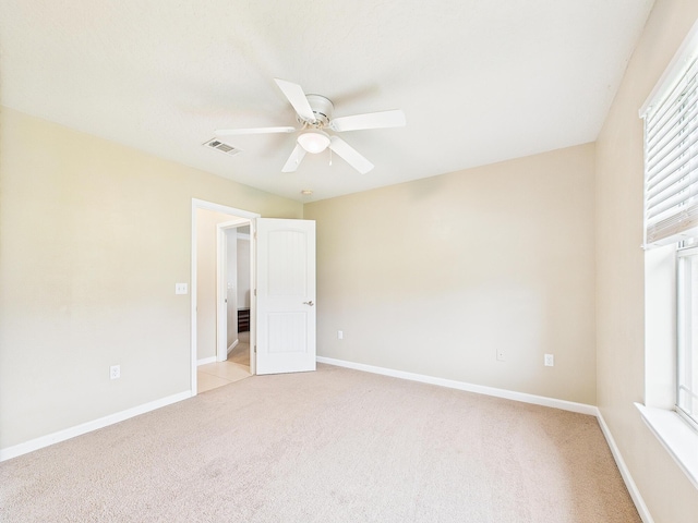 5261 Moore Loop, Crestview, FL 32536 - spare room featuring a ceiling fan and light colored carpet