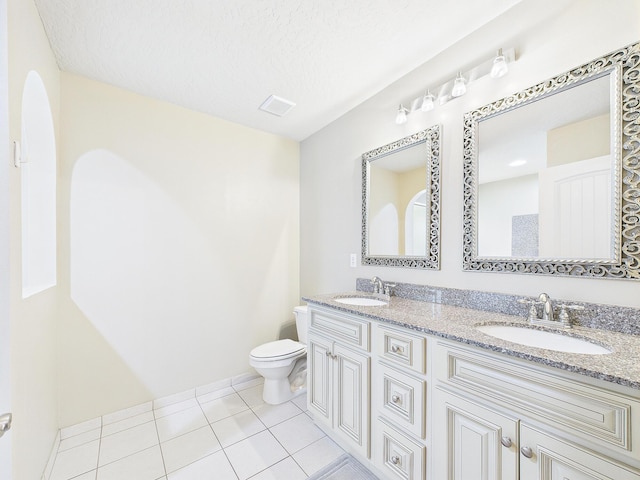 5261 Moore Loop, Crestview, FL 32536 - full bathroom with double vanity, tile patterned floors, and a textured ceiling