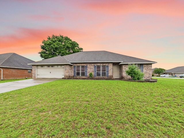 5261 Moore Loop, Crestview, FL 32536 - ranch-style house with driveway, a garage, a lawn, and brick siding