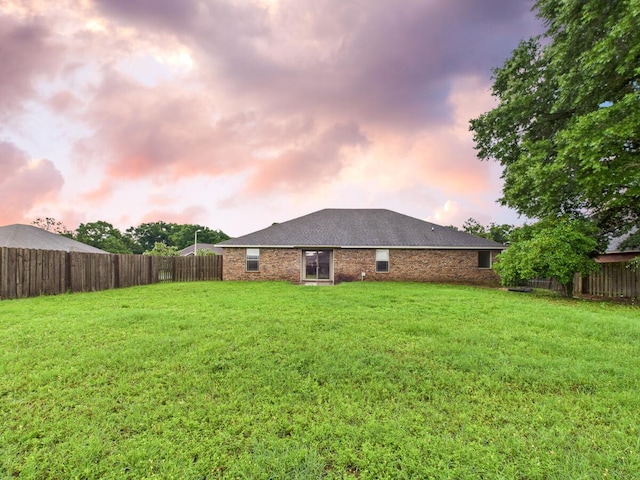 5261 Moore Loop, Crestview, FL 32536 - rear view of property with a fenced backyard and brick siding