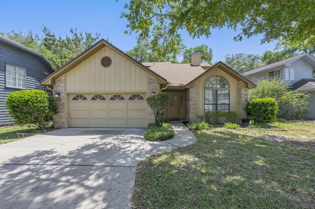 1405 Ariel Ln, Fort Walton Beach, FL 32547 - single story home with brick siding, concrete driveway, an attached garage, a chimney, and a front yard