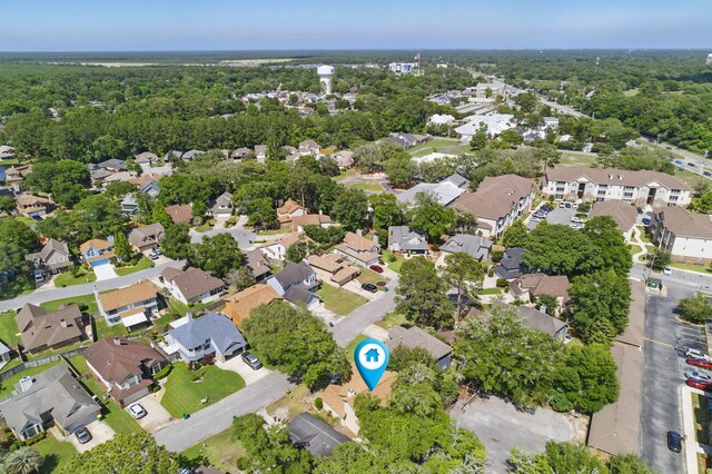 1405 Ariel Ln, Fort Walton Beach, FL 32547 - aerial overview of property's location with nearby suburban area and a forest