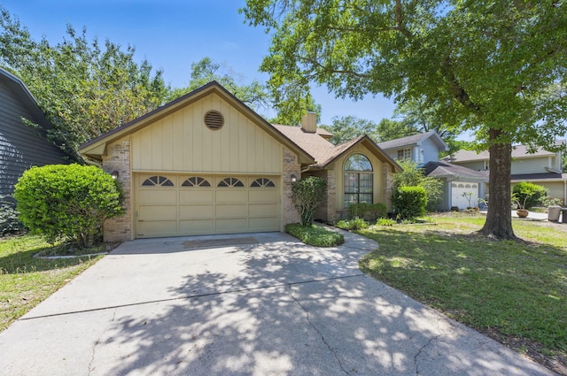 1405 Ariel Ln, Fort Walton Beach, FL 32547 - view of front of property featuring brick siding, concrete driveway, an attached garage, and a chimney