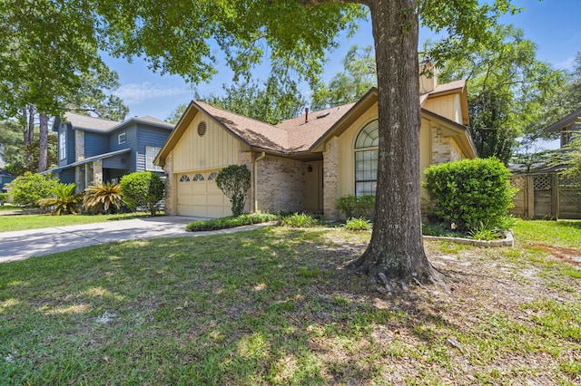 1405 Ariel Ln, Fort Walton Beach, FL 32547 - view of front of home with an attached garage, concrete driveway, and brick siding