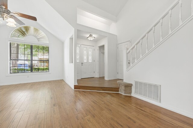 1405 Ariel Ln, Fort Walton Beach, FL 32547 - foyer with a ceiling fan, healthy amount of natural light, vaulted ceiling, wood finished floors, and baseboards