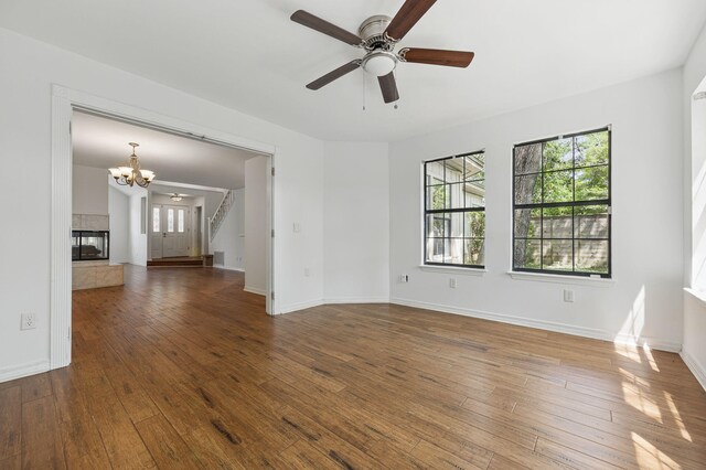 1405 Ariel Ln, Fort Walton Beach, FL 32547 - unfurnished room with a chandelier, hardwood / wood-style flooring, stairway, and plenty of natural light