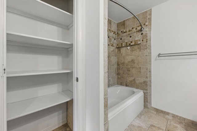 1405 Ariel Ln, Fort Walton Beach, FL 32547 - bathroom with shower / bathtub combination and baseboards