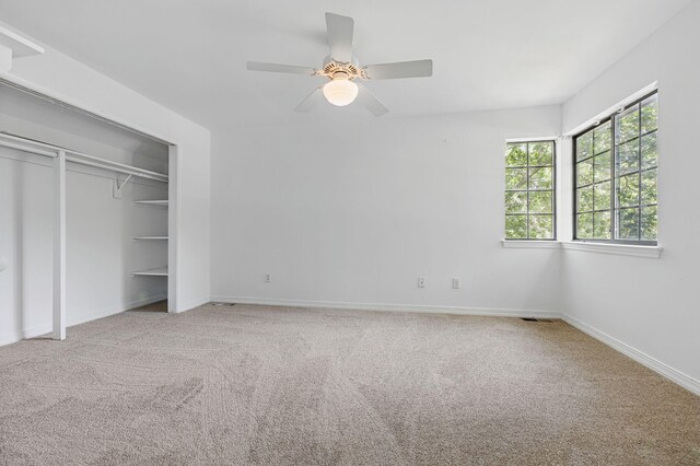 1405 Ariel Ln, Fort Walton Beach, FL 32547 - unfurnished bedroom featuring carpet, baseboards, a ceiling fan, and a closet