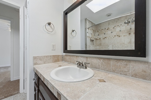 1405 Ariel Ln, Fort Walton Beach, FL 32547 - full bathroom with tiled shower, a skylight, and vanity