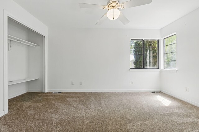 1405 Ariel Ln, Fort Walton Beach, FL 32547 - unfurnished bedroom with carpet floors, baseboards, a closet, and ceiling fan