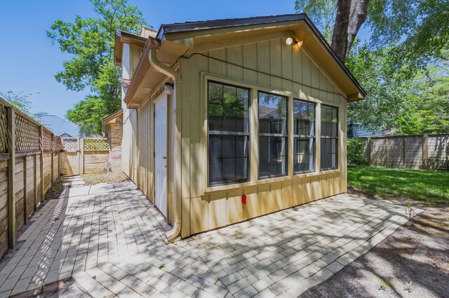 1405 Ariel Ln, Fort Walton Beach, FL 32547 - view of side of home featuring a patio area and a fenced backyard