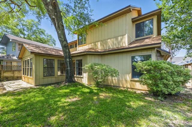 1405 Ariel Ln, Fort Walton Beach, FL 32547 - back of property with a patio and roof with shingles
