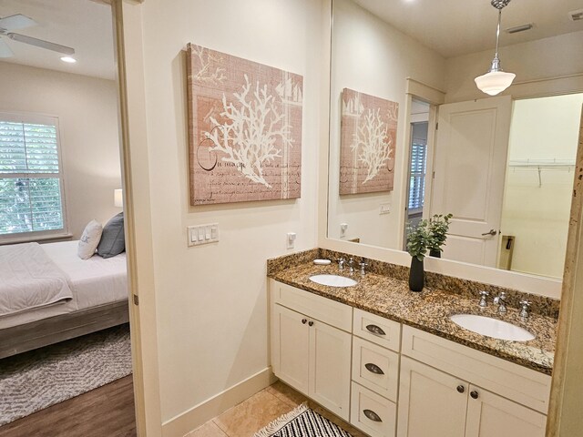 10 Gulfview Way, Santa Rosa Beach, FL 32459 - full bathroom with baseboards, double vanity, connected bathroom, and ceiling fan