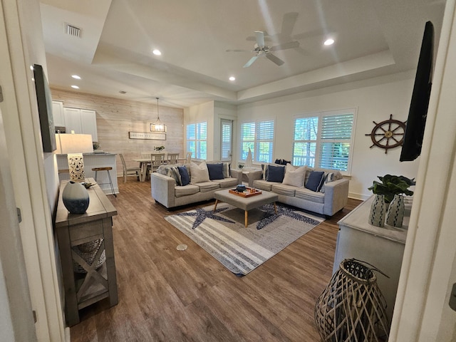 10 Gulfview Way, Santa Rosa Beach, FL 32459 - living area with a raised ceiling, a ceiling fan, dark wood-style floors, recessed lighting, and wooden walls