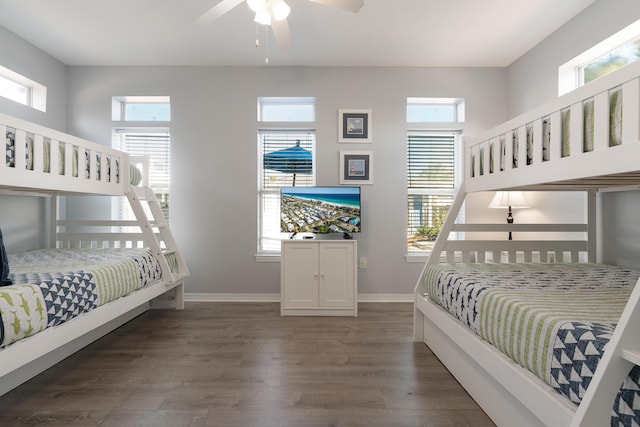 77 Mark St, Destin, FL 32541 - bedroom with dark wood-style floors, multiple windows, and baseboards