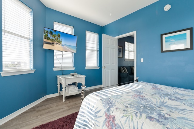 77 Mark St, Destin, FL 32541 - bedroom with wood finished floors and baseboards