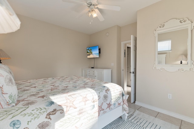 77 Mark St, Destin, FL 32541 - bedroom with light tile patterned flooring, a ceiling fan, and baseboards