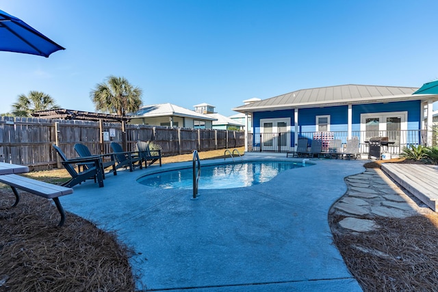 77 Mark St, Destin, FL 32541 - view of swimming pool with french doors, a fenced backyard, a patio area, and area for grilling