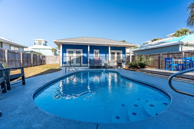 77 Mark St, Destin, FL 32541 - view of swimming pool with a fenced backyard, a patio area, and french doors
