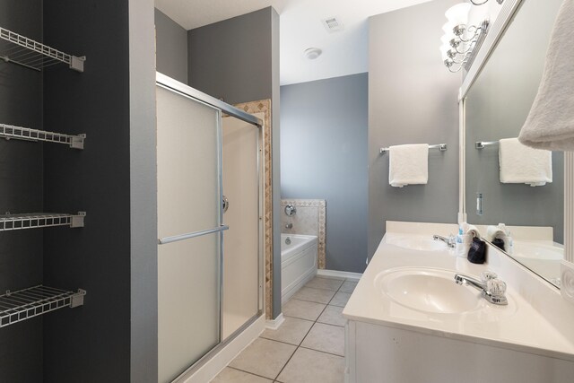 77 Mark St, Destin, FL 32541 - bathroom featuring a stall shower, tile patterned floors, a garden tub, and double vanity
