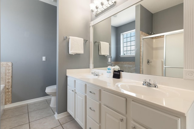 77 Mark St, Destin, FL 32541 - full bath featuring toilet, a stall shower, tile patterned floors, double vanity, and baseboards
