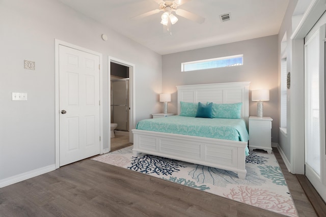 77 Mark St, Destin, FL 32541 - bedroom featuring wood finished floors, baseboards, a ceiling fan, and connected bathroom