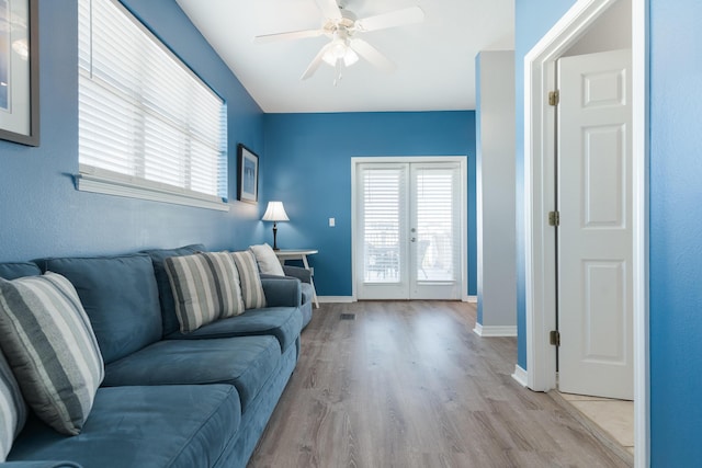 77 Mark St, Destin, FL 32541 - living area featuring french doors, a ceiling fan, light wood finished floors, and plenty of natural light