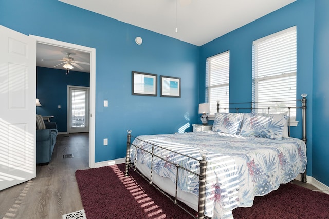 77 Mark St, Destin, FL 32541 - bedroom featuring wood finished floors, multiple windows, and baseboards