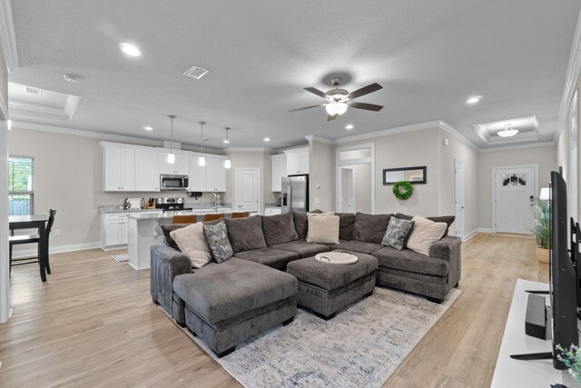 5414 Harmony Ln, Gulf Breeze, FL 32563 - living area with baseboards, light wood-style floors, recessed lighting, ceiling fan, and crown molding