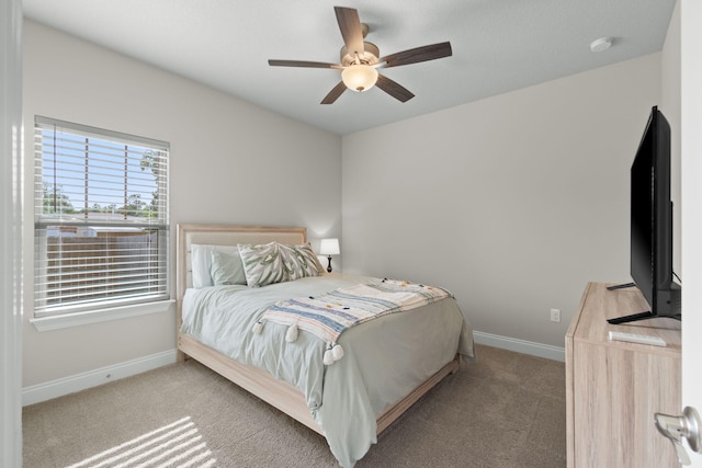 5414 Harmony Ln, Gulf Breeze, FL 32563 - carpeted bedroom featuring baseboards and a ceiling fan