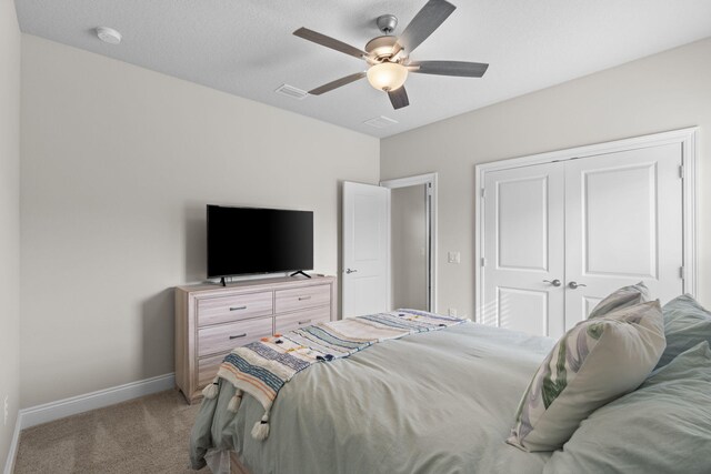 5414 Harmony Ln, Gulf Breeze, FL 32563 - bedroom with light carpet, a closet, baseboards, and a ceiling fan