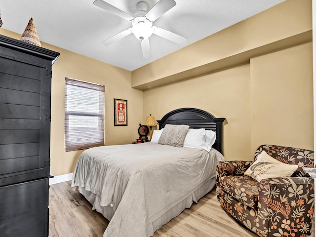 14825 Front Beach Rd Unit 1904, Panama City Beach, FL 32413 - bedroom with light wood-type flooring, a ceiling fan, and baseboards